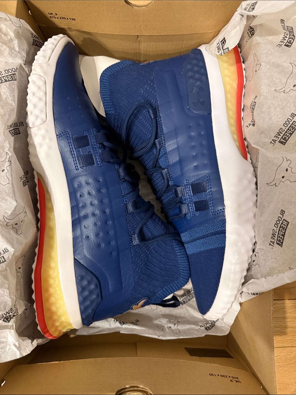 Under Armour Project Rock Navy Blue Training Shoes with Red & Yellow Heel Accent
